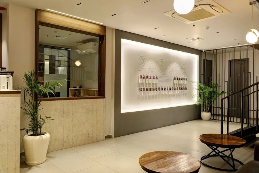 Bite Dental Gurugram clinic reception with 24:7:365 wall